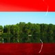 A photo of a river suffering from drought, colored red, with a rectangle of the same river, lush and green, cut out of the center