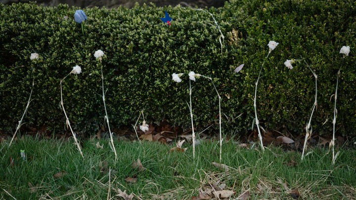 Flowers representing some of the victims of the Tree of Life shooting, placed at a memorial outside the synagogue