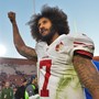 Colin Kaepernick raises a fist after a 49ers win in December 2016