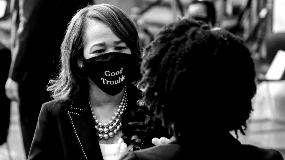 Representative Lisa Blunt Rochester wearing a "good trouble" mask