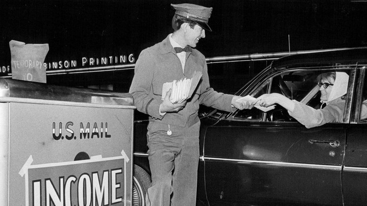 A postman collecting tax returns.