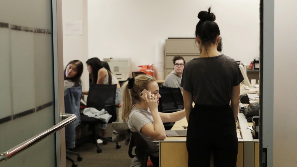 Student journalists in a newsroom