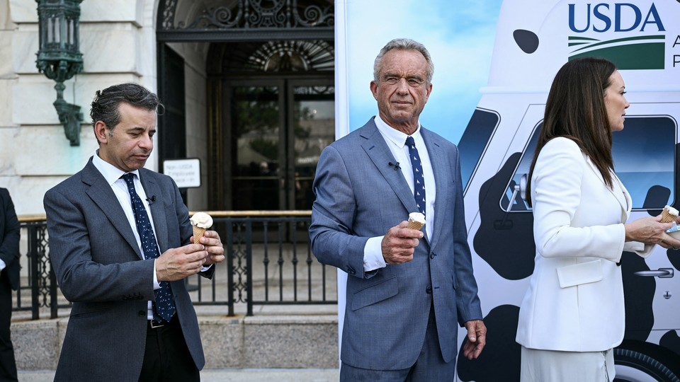 RFK Jr. poses holding an ice cream cone