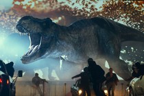 A Tyrannosaurus rex rampaging through a parking lot in "Jurassic World: Dominion"
