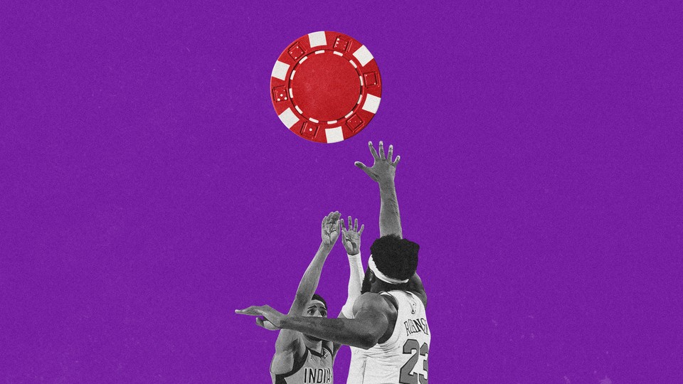 Basketball players reaching for a poker chip