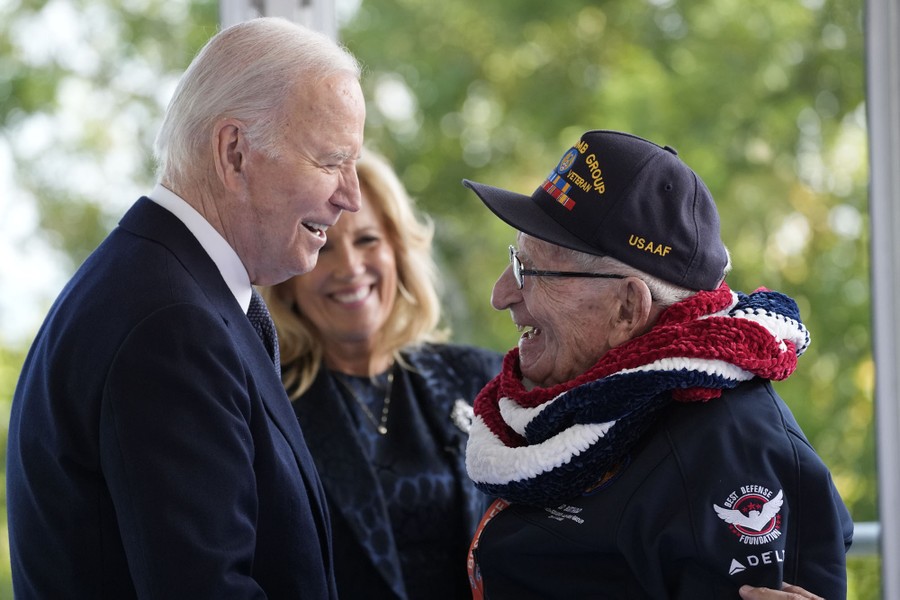 U.S. President Joe Biden and U.S. first lady Jill Biden greet a World War II veteran.