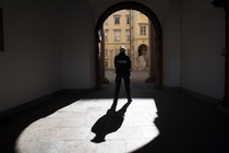 A police officer stands in an archway