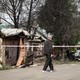 A man surveys a damaged home in Ukraine.