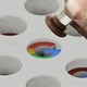 A legal hammer hitting the Google logo