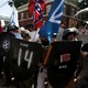White supremacists stand behind their shields at a rally in Charlottesville, Virginia.