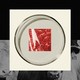 Photo of a square of red meat in a petrie dish collaged over a black and white photo of cows.