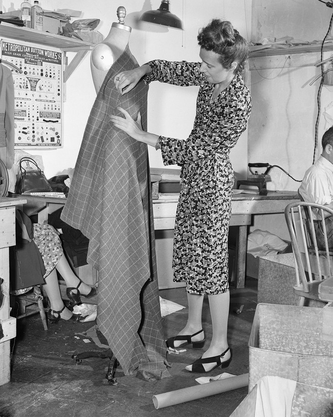 Claire McCardell designing a dress, wrapping a stretch of fabric around a mannequin