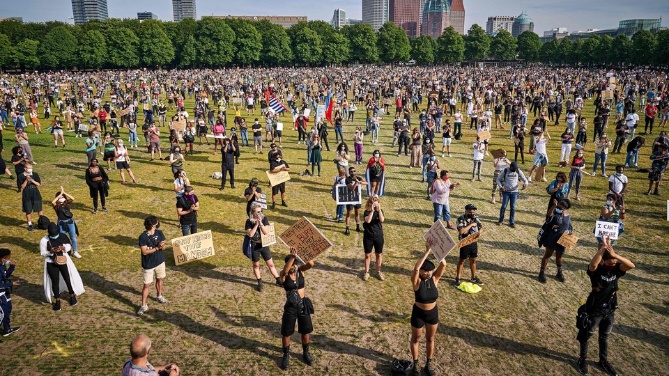 Protesters demonstrating for Black Lives Matter while socially distancing.