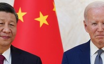 A photograph of Chinese leader Xi Jinping and U.S. President Joe Biden in front of a Chinese flag