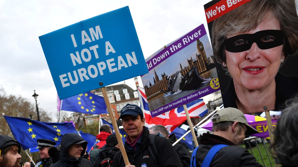 A pro-Brexit protester holds a sign that reads "I am not a European."