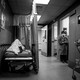 A patient rests in a corridor, waiting for a room at Providence Cedars-Sinai Tarzana Medical Center in California on January 3, 2021.