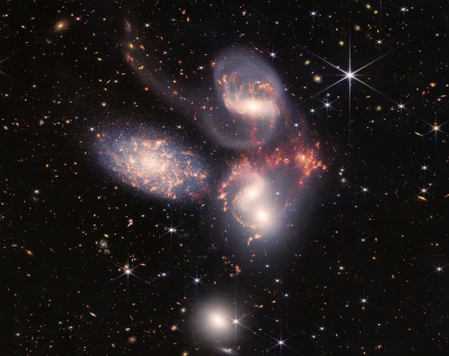 A cluster of five galaxies, appearing very close to one another in the night sky