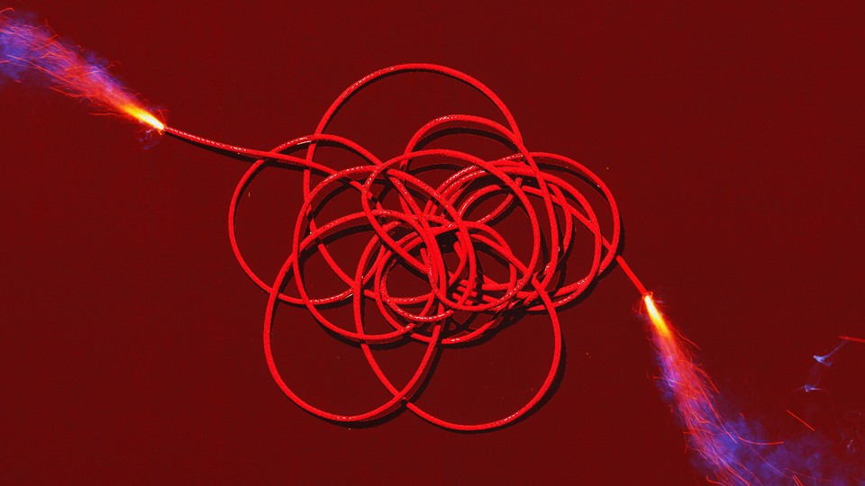 An illustration of a reel of fuse lit from both ends.