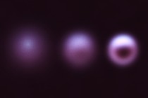 Illustration of three blurry purple circles against a black background, getting clearer from left to right