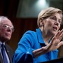 Democratic Senator Elizabeth Warren, accompanied by Senator Bernie Sanders, speaks at a health-care news conference on Capitol Hill.