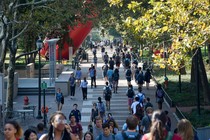 Students walking on a university sidewalk