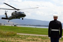 A US Marine honor guardsman stands at attention as Marine One lands with US President George W. Bush