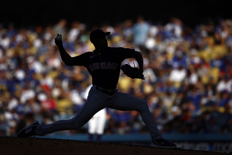 A pitcher throws a ball during a baseball game.