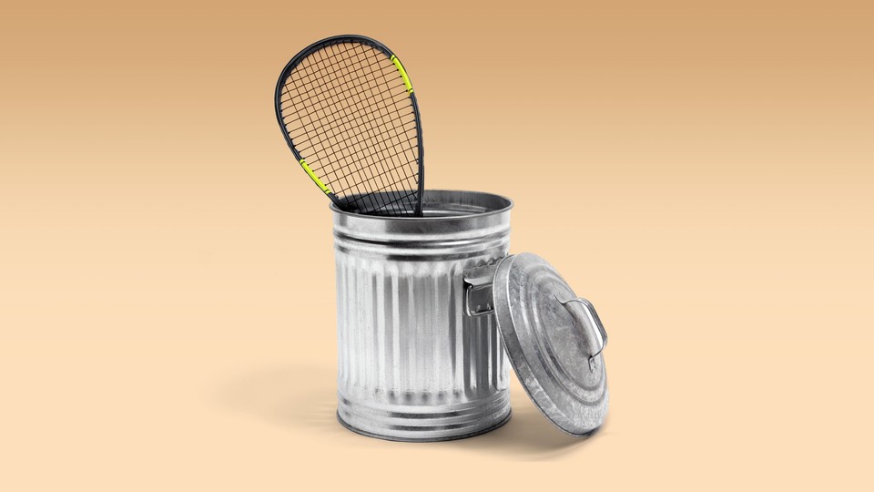An image of a squash racquet in a trash bin