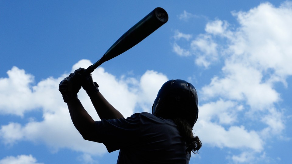 Jacqueline Reynolds swings during tryouts for the Women’s Professional Baseball League.