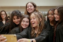 Teenagers pose for a selfie in a scene from "Girls State"