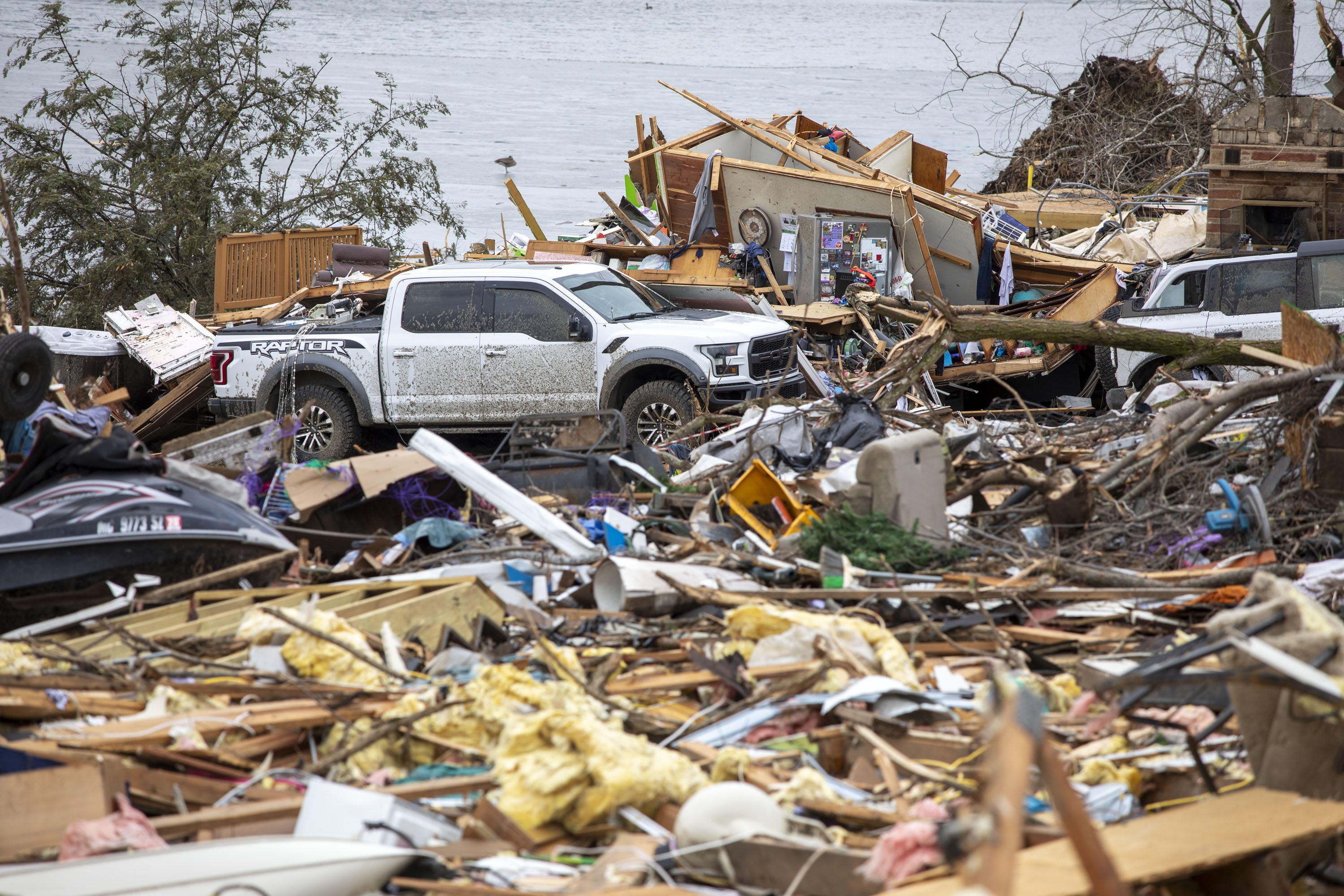 Damage and debris, seen in a wrecked neighborhood following a tornado