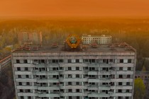 A Soviet coat of arms on a high-rise building in Pripyat