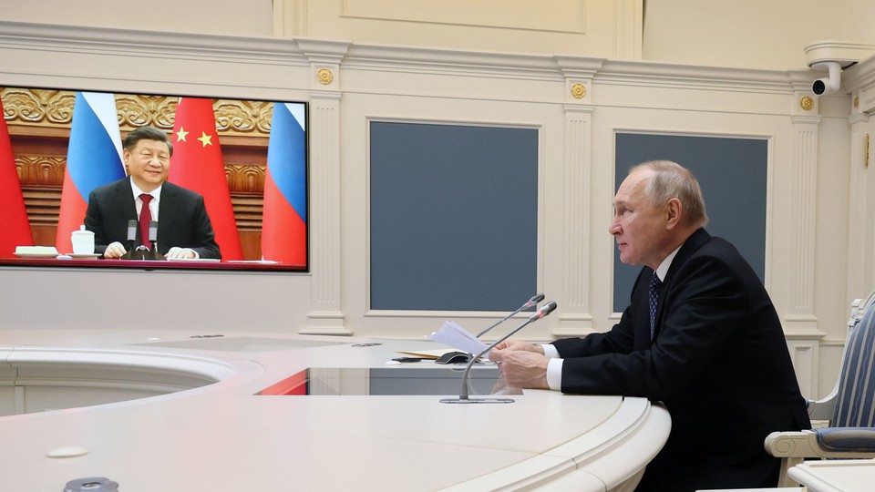 Russian President Vladimir Putin holds a video meeting with Chinese President Xi Jinping at the Kremlin, in Moscow, on December 30, 2022.