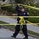 A San Francisco police officer and yellow tape