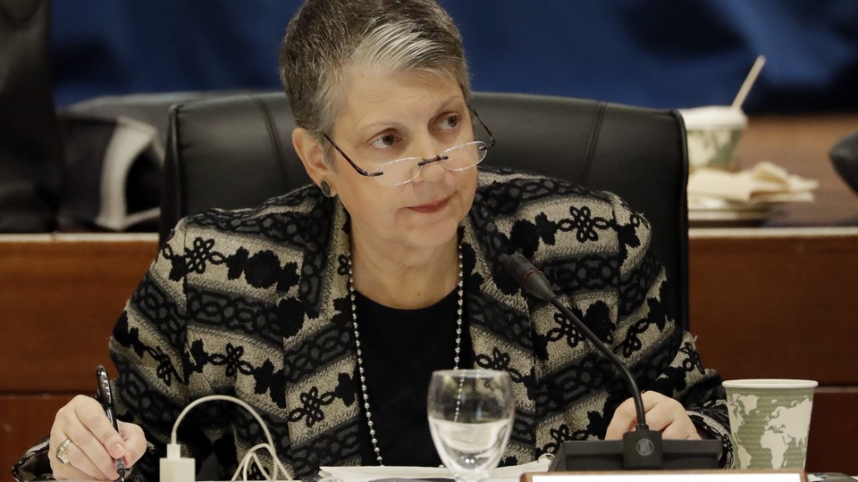 The University of California president is shown looking at someone at a Board of Regents meeting earlier this year.
