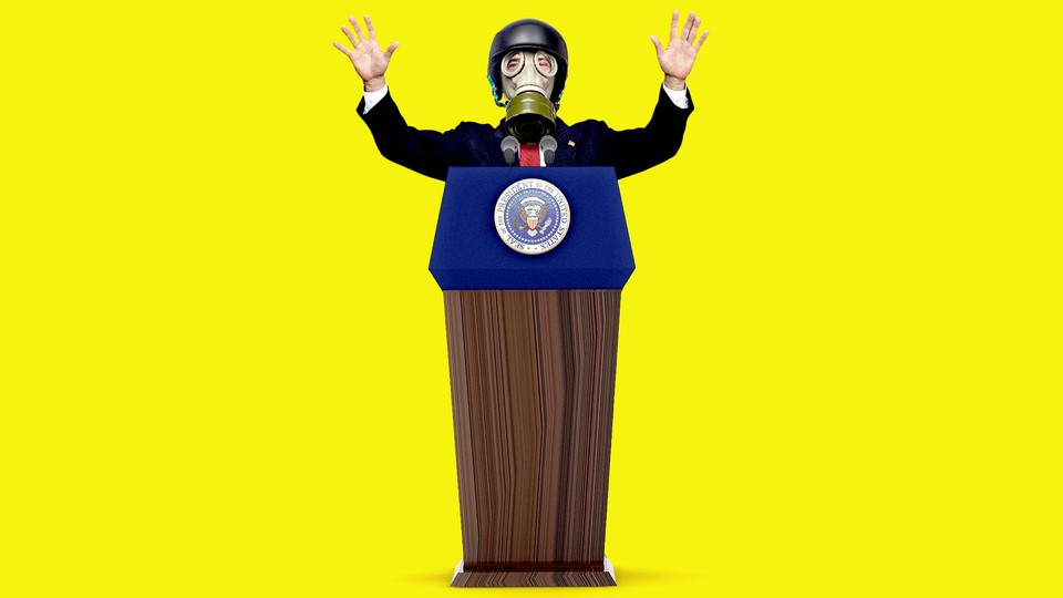 President Trump stands at a podium while wearing a gas mask with his hands raised.