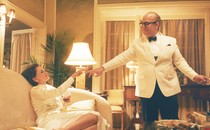 Capote and a high-society woman touch fingers