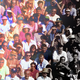 A crowd, partially black and white, partially in color