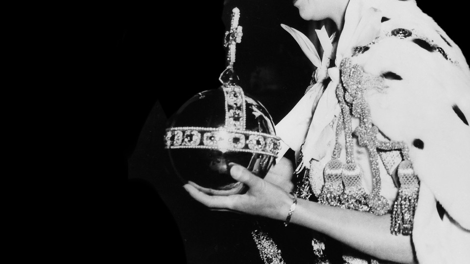 A black-and-white photograph of the Queen bearing the orb