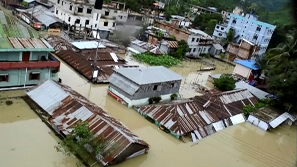 An aerial view shows Khagrachari, Bangladesh half-submerged in floodwaters following landslides triggered by heavy rain.