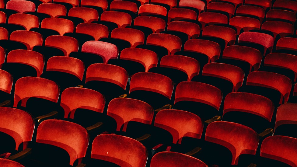 Rows of empty theater seats
