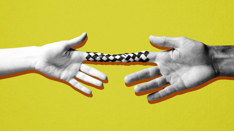Two hands stuck in a finger trap, pulling away from each other
