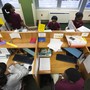An overhead shot of students working on computers