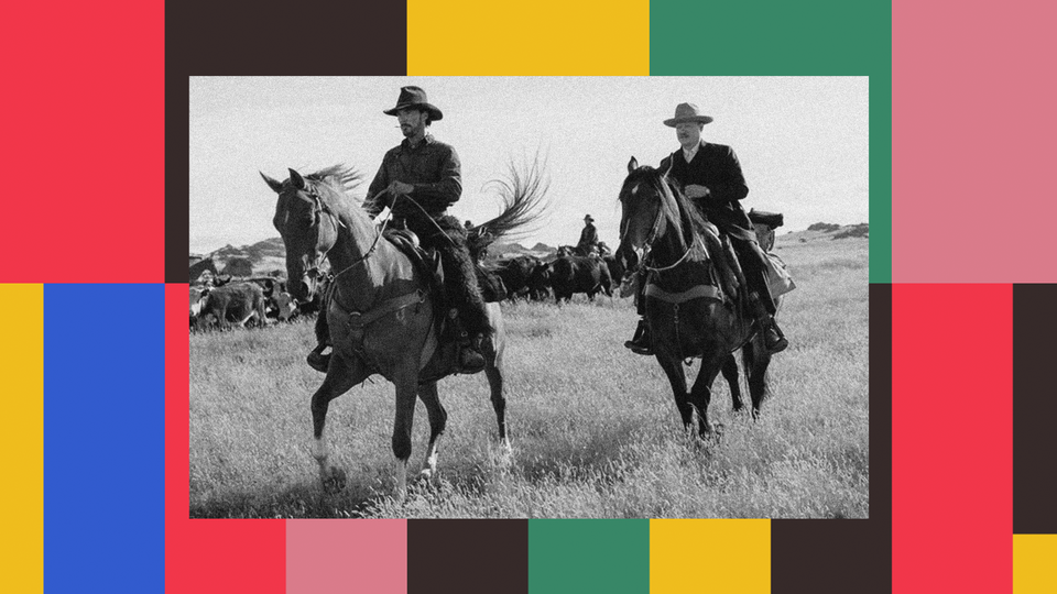 Still of Paul and George on horseback in "The Power of the Dog"