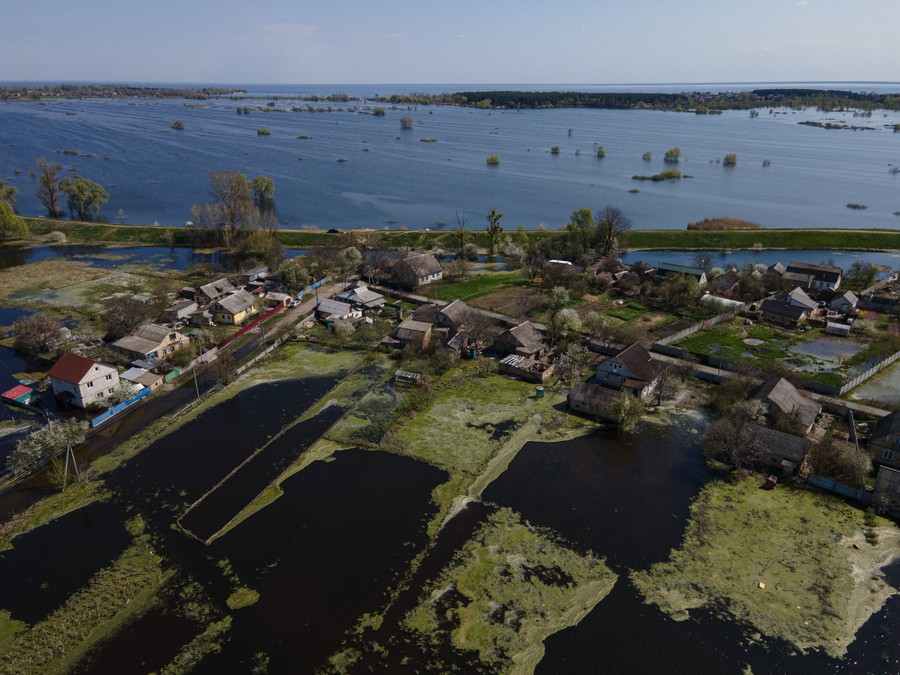 An aerial view of a partially flooded village