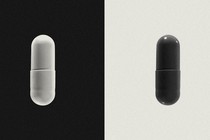 A white pill against a black background on one side of the image, a black pill against a white background on the other