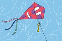 A kite with a smiley-face decoration and a key tied to its string