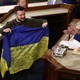 President Volodymyr Zelensky with a Ukrainian flag in the U.S. Congress