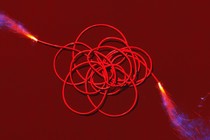 An illustration of a reel of fuse lit from both ends.