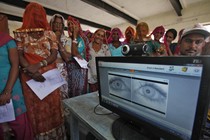 Women stand in a line to enroll in the Unique Identification (UID) database system at Merta district in the desert Indian state of Rajasthan February 22, 2013. 